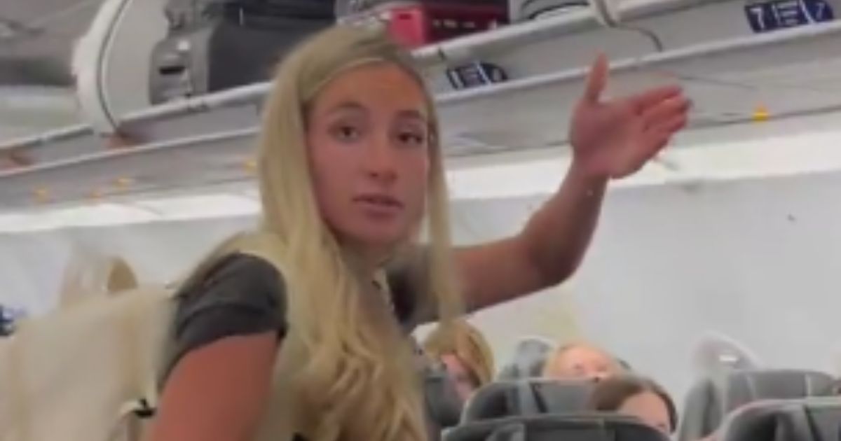 On a flight to Miami, Florida, a woman was accused of stealing another passenger's phone charger in a video that has since gone viral.