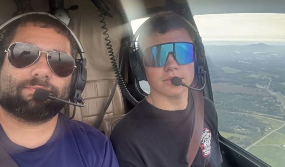 Rescue pilot Jordan Seidhom and his son.