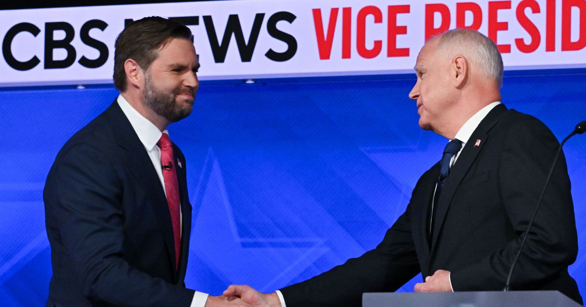 Sen. JD Vance (R-Ohio) shakes hands with Minnesota Gov. Tim Walz during the vice-presidential debate at CBS Studios on October 1, 2024 in New York, N.Y.