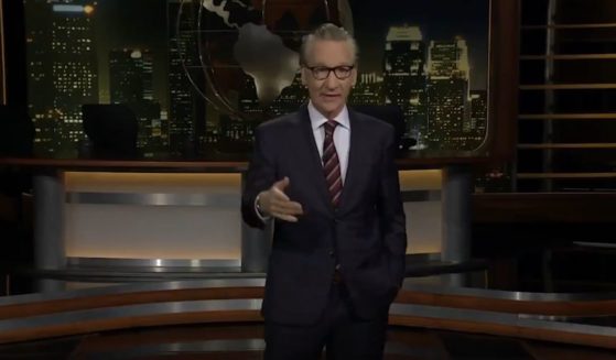 Bill Maher giving a monologue on his late night show.