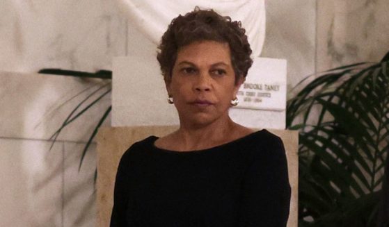 U.S. District Judge Tanya Chutkan (L), pays respect to the late retired Supreme Court Justice Sandra Day O'Connor as she lies in repose at the U.S. Supreme Court on December 18, 2023 in Washington, DC.