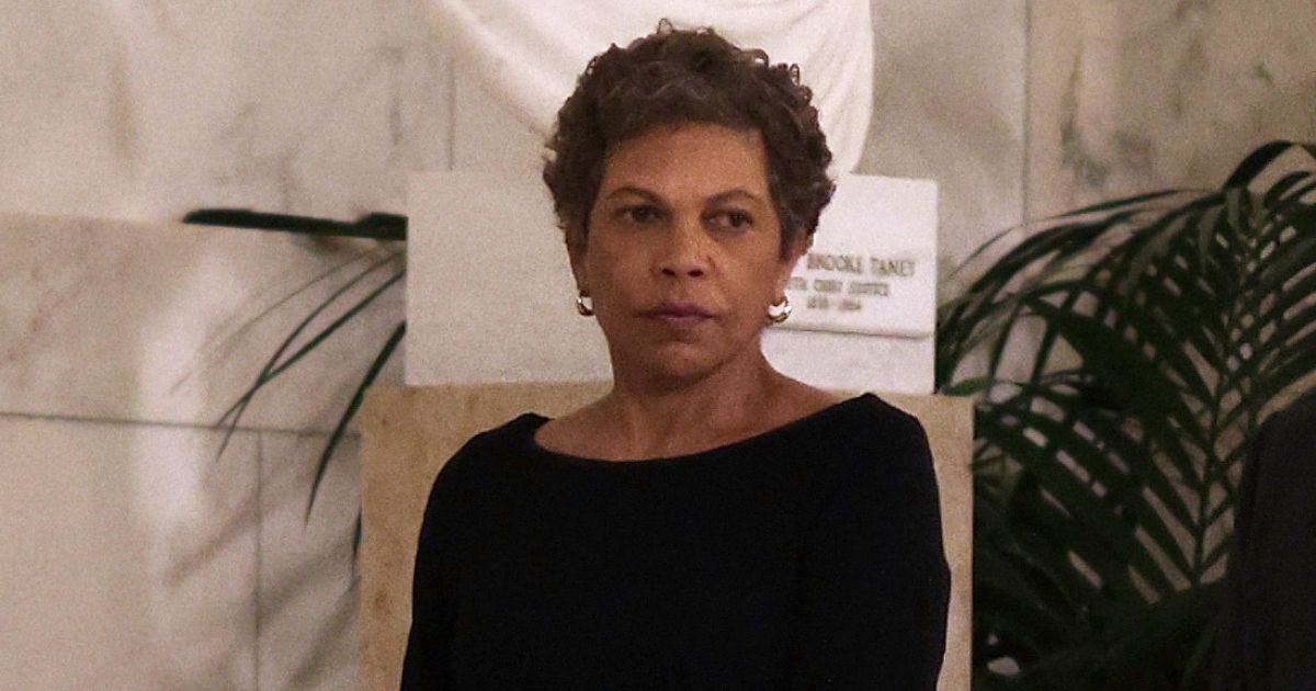 U.S. District Judge Tanya Chutkan (L), pays respect to the late retired Supreme Court Justice Sandra Day O'Connor as she lies in repose at the U.S. Supreme Court on December 18, 2023 in Washington, DC.