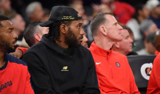 Kawhi Leonard #2 of the LA Clippers sits on the bench during the game against the Dallas Mavericks at Intuit Dome on October 14, 2024 in Inglewood, California.