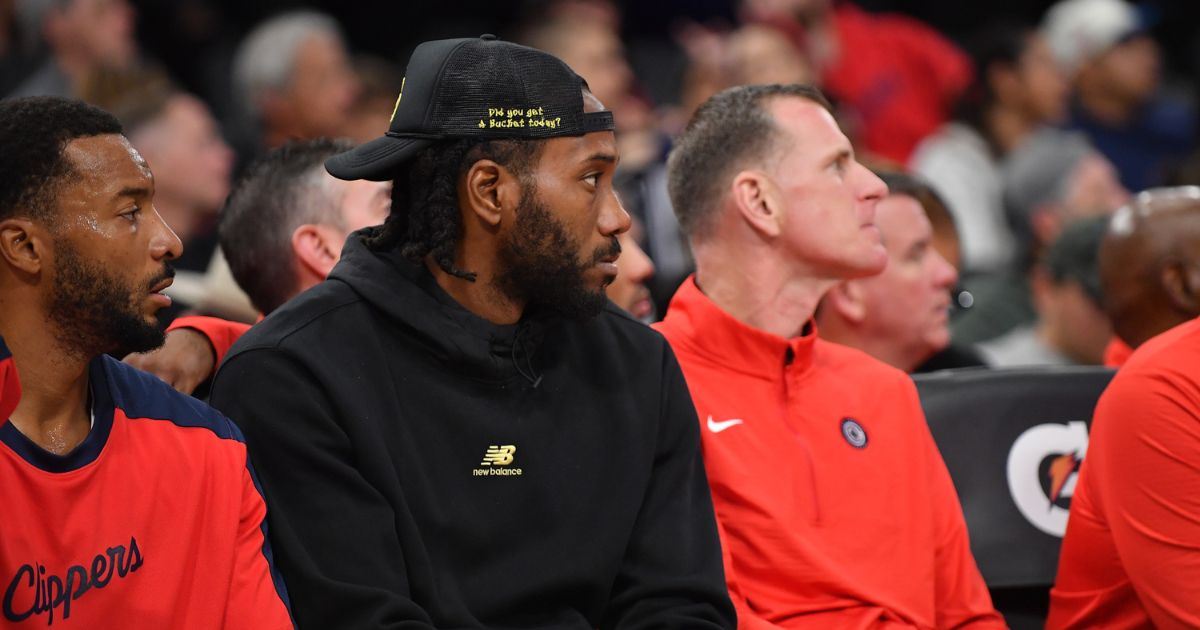 Kawhi Leonard #2 of the LA Clippers sits on the bench during the game against the Dallas Mavericks at Intuit Dome on October 14, 2024 in Inglewood, California.