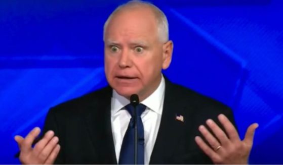 Gov. Tim Walz reacts during the vice presidential debate against Sen. J.D. Vance on Tuesday in New York City.