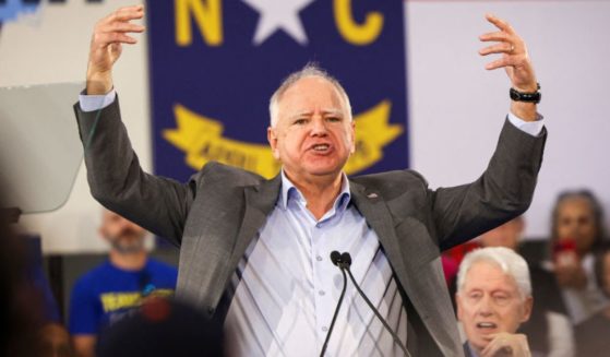 Democratic vice presidential nominee Tim Walz gestures as he speaks during a Get-Out-The-Vote rally with former US President Bill Clinton for Vice President and Democratic Presidential nominee Kamala Harris on the first day of North Carolina early voting in Durham, North Carolina, Thursday.