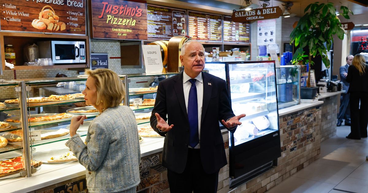 Watch: Tim Walz looks dejected as reporters question him about his ‘school shooter’ remark while staring at pizza