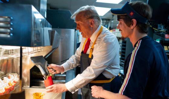 Former President Donald Trump works behind the counter during a campaign event at a McDonald's in Feasterville-Trevose, Pennsylvania, on Sunday.