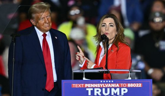 U.S. Shadow Senator from Puerto Rico Zoraida Buxo Santiago. speaks next to former President and Republican presidential candidate Donald Trump during a campaign rally Tuesday in Allentown, Pennsylvania.