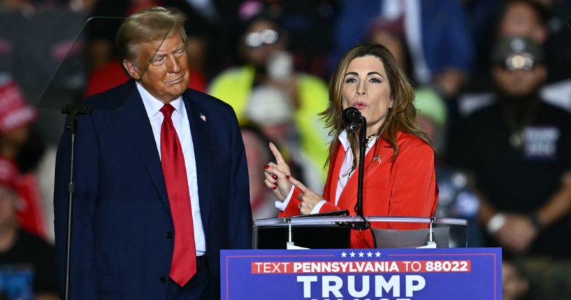 U.S. Shadow Senator from Puerto Rico Zoraida Buxo Santiago. speaks next to former President and Republican presidential candidate Donald Trump during a campaign rally Tuesday in Allentown, Pennsylvania.