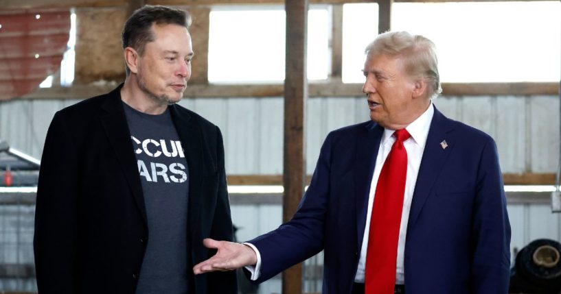 Former President Donald Trump meets with Elon Musk backstage Oct. 5 during a campaign rally in Butler, Pennsylvania.