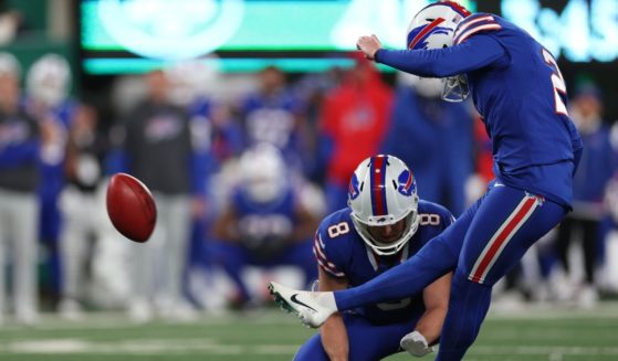 Buffalo Bills kicker Tyler Bass, right, kicks a field goal in the fourth quarter against the New York Jets in East Rutherford, New Jersey, on Monday.