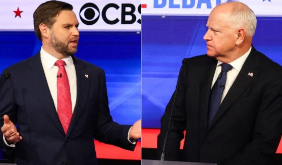 Sen. J.D. Vance speaks, as Gov. Tim Walz reacts, during the vice presidential debate in New York City on Tuesday.