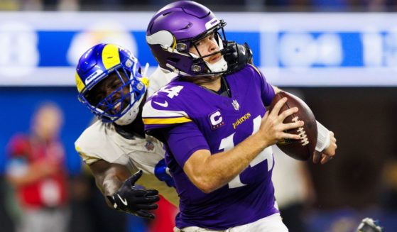 Jared Verse, left, of the Los Angeles Rams sacks Sam Darnold, right, of the Minnesota Vikings for a safety during the second half of an NFL game in Inglewood, California, on Thursday.