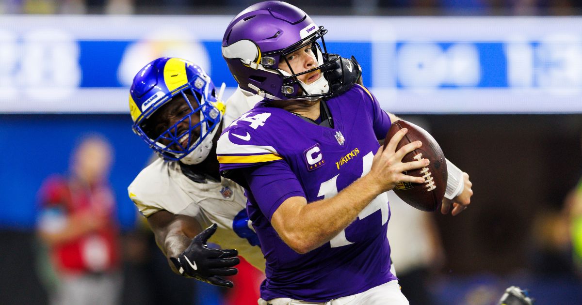 Jared Verse, left, of the Los Angeles Rams sacks Sam Darnold, right, of the Minnesota Vikings for a safety during the second half of an NFL game in Inglewood, California, on Thursday.