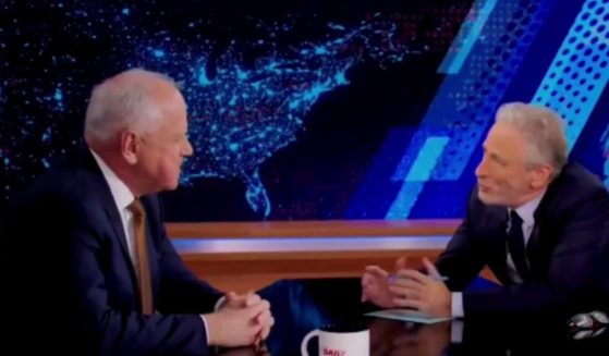 On Monday, Democratic vice presidential candidate Tim Walz, left, appeared on "The Daily Show" where he gave Republicans permission to vote for the Harris-Walz ticket, but host Jon Stewart, right, pushed back after one particular comparison.