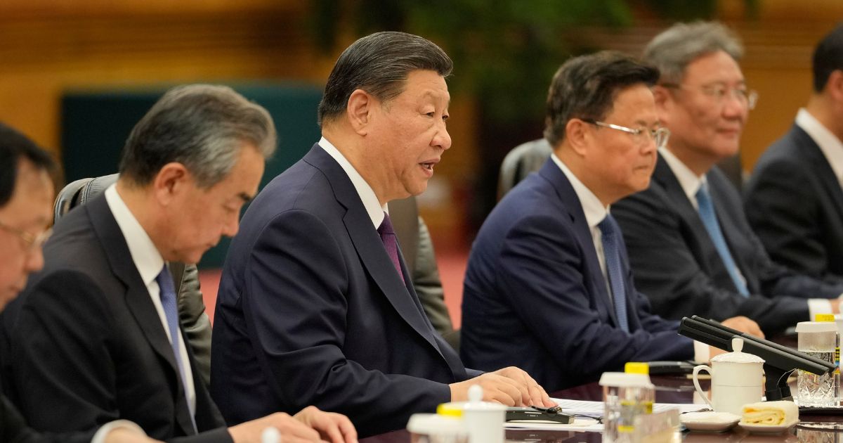 Chinese President Xi Jinping, second from left, and his delegation attend a meeting with Guinea-Bissau President Umaro Sissoco Embalo at the Great Hall of the People on July 10, 2024 in Beijing, China.