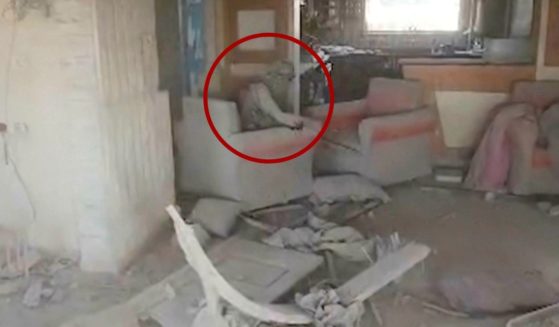 Video provided by the Israel Defense Force shows a heavily damaged building with a person the Israeli military identified as Hamas leader Yahya Sinwar seated in a chair in Rafah, Gaza Strip, on Wednesday.