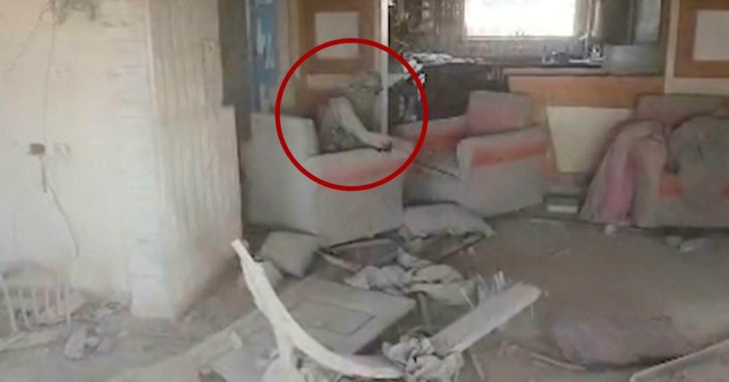 Video provided by the Israel Defense Force shows a heavily damaged building with a person the Israeli military identified as Hamas leader Yahya Sinwar seated in a chair in Rafah, Gaza Strip, on Wednesday.