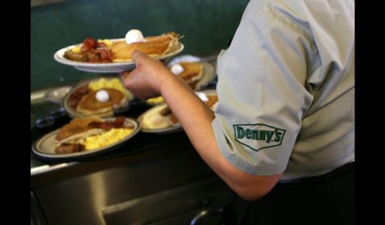 Denny's waitress Hirut Bizuneh prepares to deliver free Grand Slam breakfasts to customers February 3, 2009 in Emeryville, California.