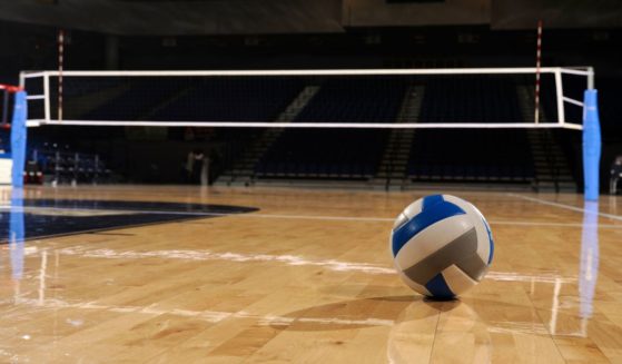 This Getty stock image shows an empty volleyball court with a ball on it.