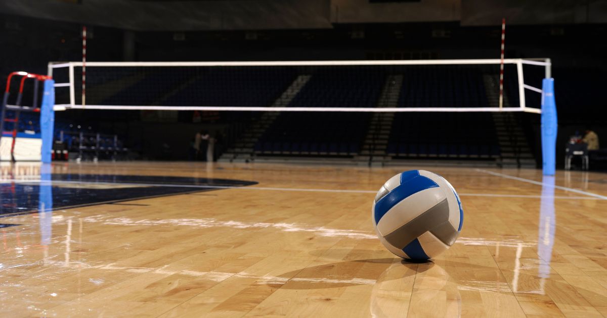 This Getty stock image shows an empty volleyball court with a ball on it.