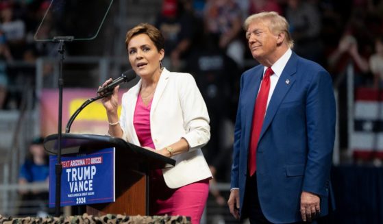 U.S. Republican presidential nominee, former President Donald Trump invites Arizona Republican U.S. Senate candidate Kari Lake on stage during a campaign rally at Findlay Toyota Center on October 13, 2024 in Prescott Valley, Arizona.