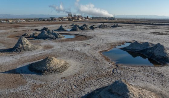 In an aerial view, mud pots, or fumaroles, and mud volcanoes are seen near the Hudson Ranch geothermal power plant on February 14, 2024 near Niland, California. Geothermal plants create steam power from boiling, mineral-rich brine drawn from deep under geothermal fields. A race is on to develop processing to separate raw lithium out of the waste stream to be used in the production of batteries for electric vehicles. This geothermal field at the eastern edge of the Salton Sea has is being called the future "Lithium Valley", with the potential to extract 18 million metric tons of lithium from this geothermal field, roughly the equivalent of 382 million electric vehicle batteries, according to a report by the Lawrence Berkeley National Laboratory. The area is believed to have the world's highest concentration of lithium contained in geothermal brines.