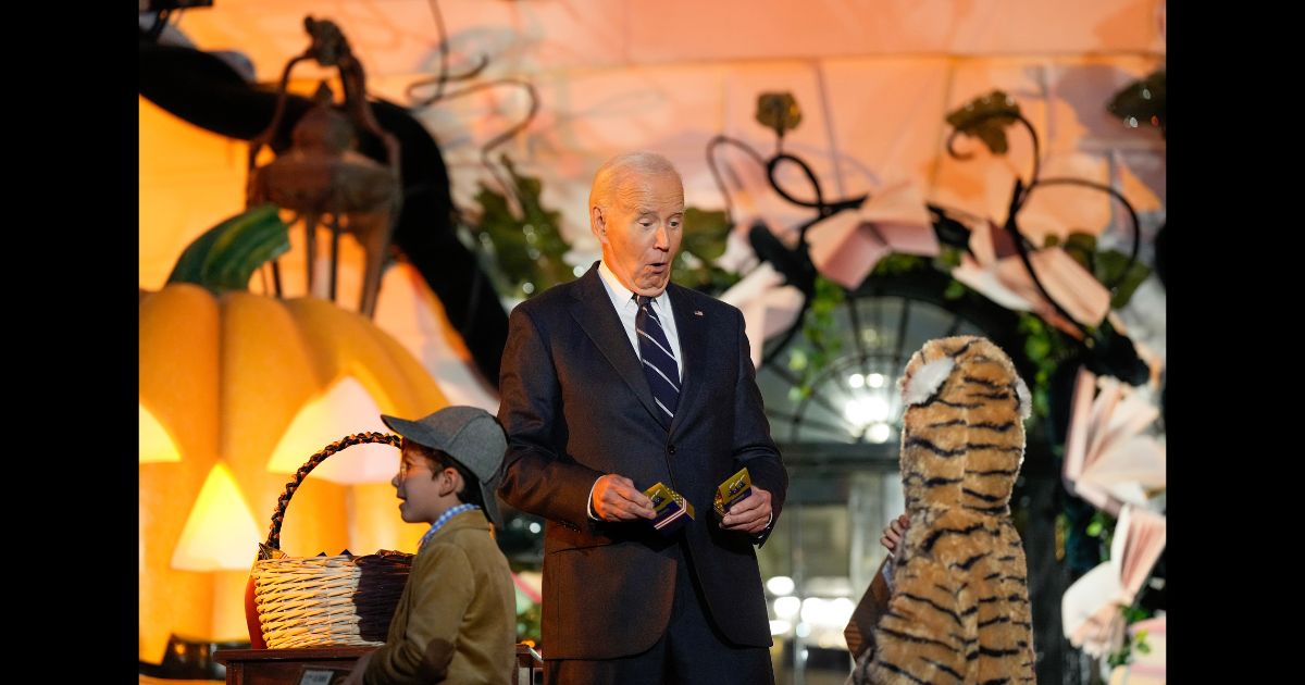 US President Joe Biden greets a trick-or-treater during a Halloween event at the White House on October 30, 2024 in Washington, DC.