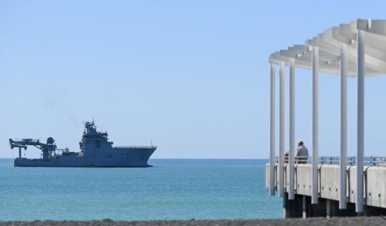 The HMNZS Manawanui sits offshore before the memorial service on February 14, 2024 in Napier, New Zealand.