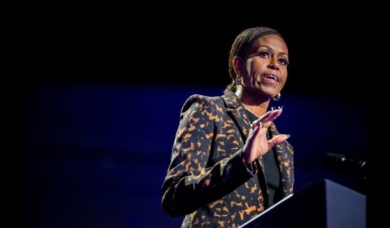 Former first lady Michelle Obama speaks ahead of the arrival of Democratic presidential nominee, U.S. Vice President Kamala Harris during a campaign rally at the Wings Event Center on October 26, 2024 in Kalamazoo, Michigan.