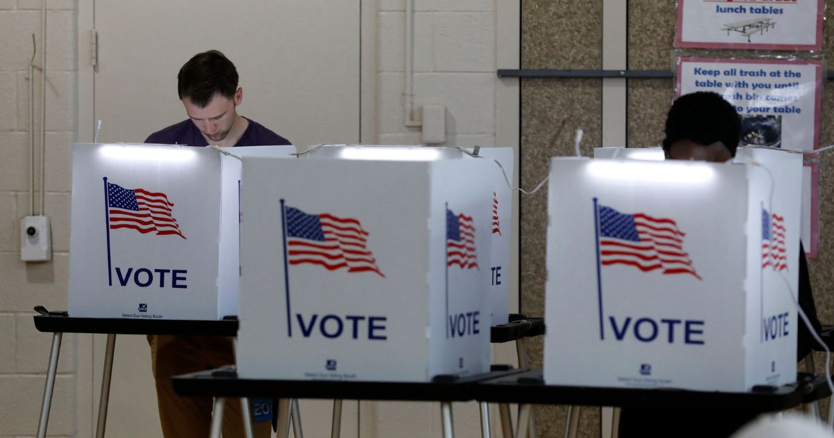 People vote in the Michigan primary election at Chrysler Elementary School in Detroit, Michigan, on March 10, 2020.