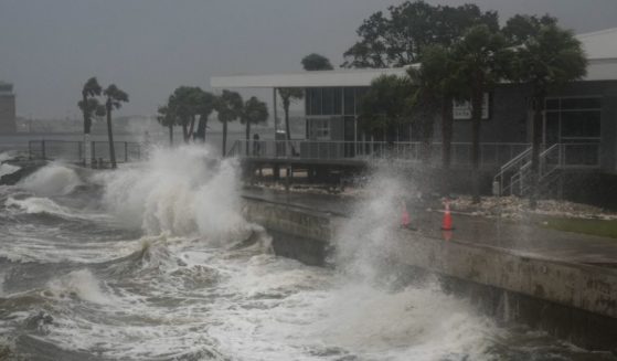 Waves crash along St. Pete Pier in St. Petersburg, Florida, as Hurricane Milton is expected to make landfall tonight on October 9, 2024.