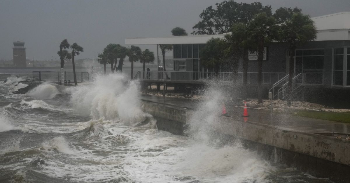 Waves crash along St. Pete Pier in St. Petersburg, Florida, as Hurricane Milton is expected to make landfall tonight on October 9, 2024.