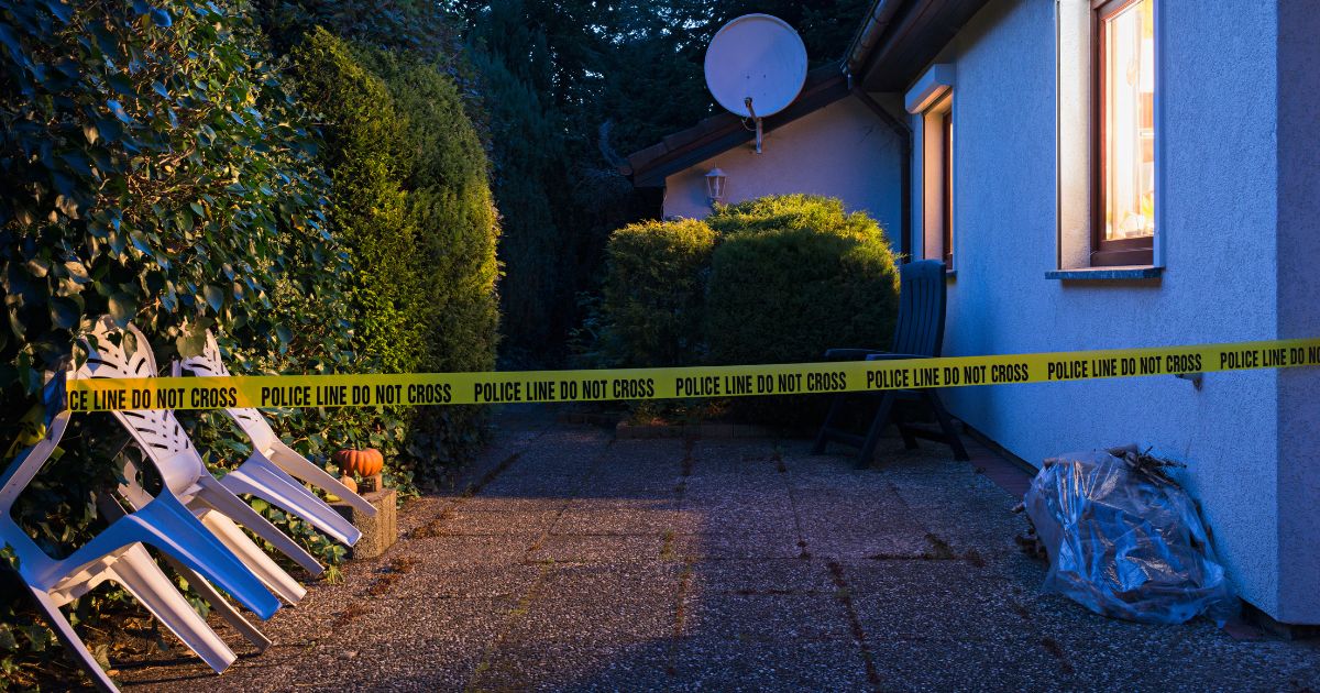 This Getty stock image shows police tape surrounding the yard of a house.