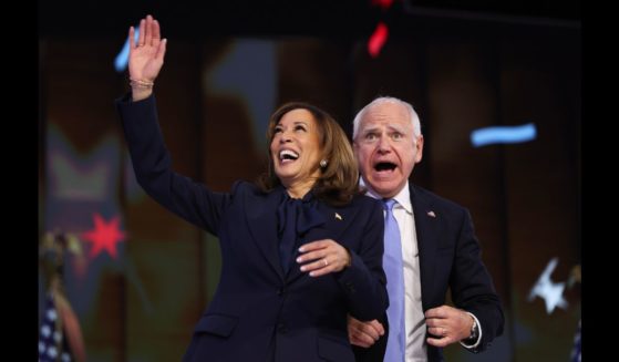 Democratic presidential nominee, U.S. Vice President Kamala Harris and Democratic vice presidential nominee Minnesota Gov. Tim Walz celebrate during the final day of the Democratic National Convention at the United Center on August 22, 2024 in Chicago, Illinois.