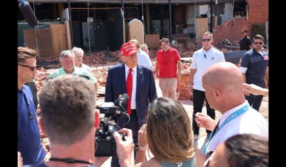 Republican presidential nominee, former U.S. President Donald Trump, speaks with press as he visits Chez What Furniture store which was damaged during Hurricane Helene on September 30, 2024 in Valdosta, Georgia.