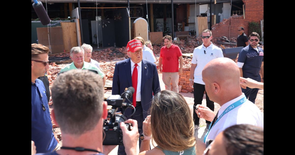 Republican presidential nominee, former U.S. President Donald Trump, speaks with press as he visits Chez What Furniture store which was damaged during Hurricane Helene on September 30, 2024 in Valdosta, Georgia.