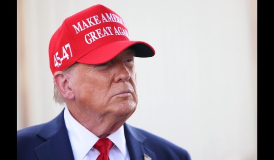 Republican presidential nominee, former U.S. President Donald Trump gives brief statements as he arrives at Valdosta Regional Airport to visit areas affected by Hurricane Helene on September 30, 2024 in Valdosta, Georgia.