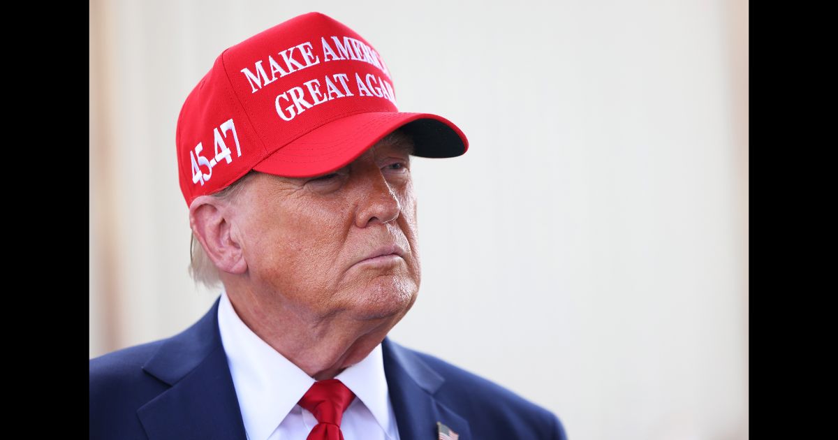 Republican presidential nominee, former U.S. President Donald Trump gives brief statements as he arrives at Valdosta Regional Airport to visit areas affected by Hurricane Helene on September 30, 2024 in Valdosta, Georgia.