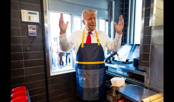 Republican presidential nominee, former U.S. President Donald Trump works behind the counter during a campaign event at McDonald's restaurant on October 20, 2024 in Feasterville-Trevose, Pennsylvania.