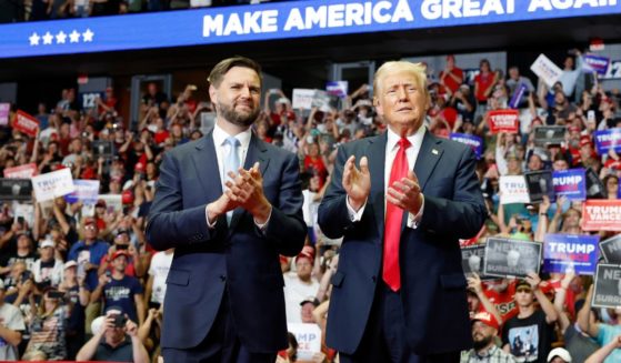 Republican presidential nominee, former U.S. President Donald Trump stands onstage with Republican vice presidential candidate, Sen. J.D. Vance (R-OH) during a campaign rally at the Van Andel Arena on July 20, 2024 in Grand Rapids, Michigan.