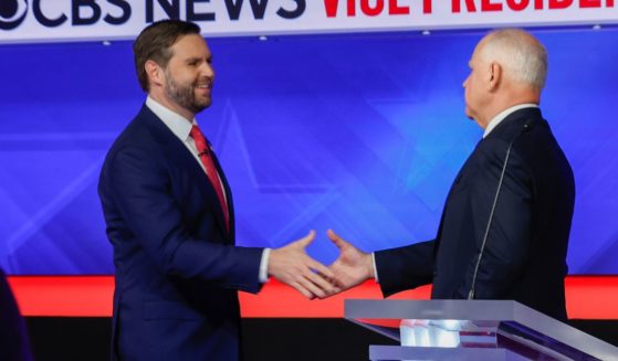 Democratic vice presidential candidate Minnesota Gov. Tim Walz and Republican vice presidential candidate Sen. JD Vance (R-OH) shake hands after a debate at the CBS Broadcast Center on October 1, 2024 in New York City.