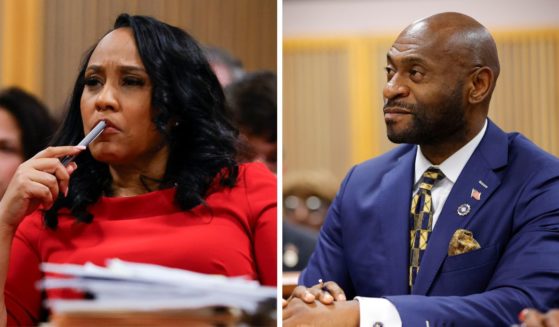 (L) Fulton County District Attorney Fani Willis looks on during a hearing in the case of the State of Georgia v. Donald John Trump at the Fulton County Courthouse on March 1, 2024, in Atlanta, Georgia. (R) Special prosecutor Nathan Wade sits in court during a hearing in the case of the State of Georgia v. Donald John Trump at the Fulton County Courthouse on March 1, 2024 in Atlanta, Georgia.