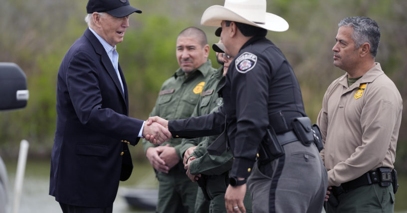 President Joe Biden, left, talks with the U.S. Border Patrol and local officials, as he looks over the southern border in Brownsville, Texas, on Feb. 29.