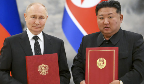 Russian President Vladimir Putin and North Korean Leader Kim Jon Un together in an Associated Press-provided photo.