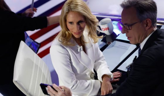 CNN hosts Jake Tapper, right, and Dana Bash, left, take a commercial break during the CNN Republican Presidential Primary Debate in Des Moines, Iowa, on Jan 10.