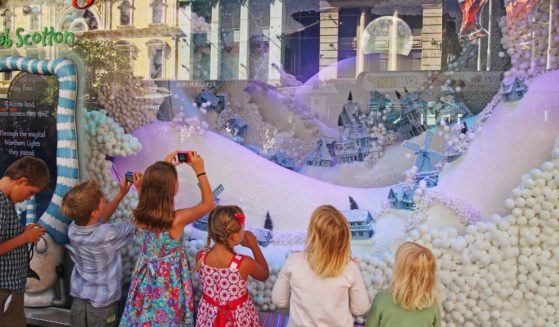 Children look at the Myer Christmas window display in Melbourne, Australia, on Dec. 20, 2012.