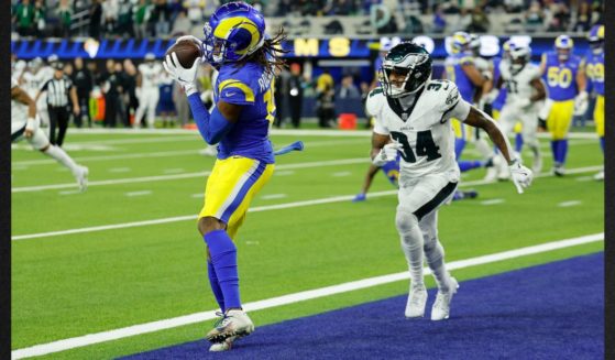 Demarcus Robinson of the Los Angeles Rams catches a touchdown pass against Isaiah Rodgers of the Philadelphia Eagles during the third quarter at SoFi Stadium Sunday in Inglewood, California.