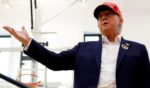 Former President Donald Trump speaks to reporters after casting his ballot in Palm Beach, Florida, on Tuesday.